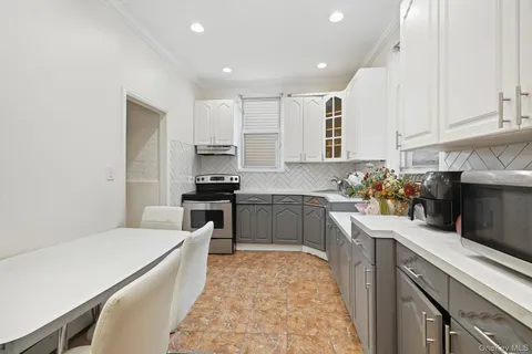 a kitchen with a sink stove and refrigerator