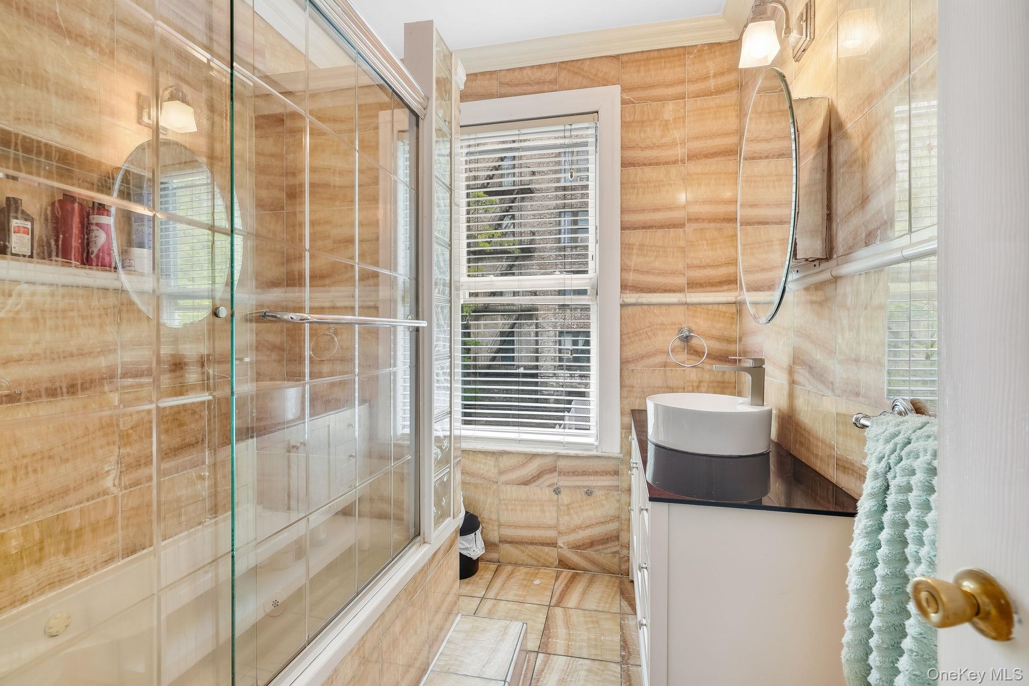 3340 Perry Avenue Bronx, NY 10467 - Photo 13 of 42 a bathroom with a toilet and a shower