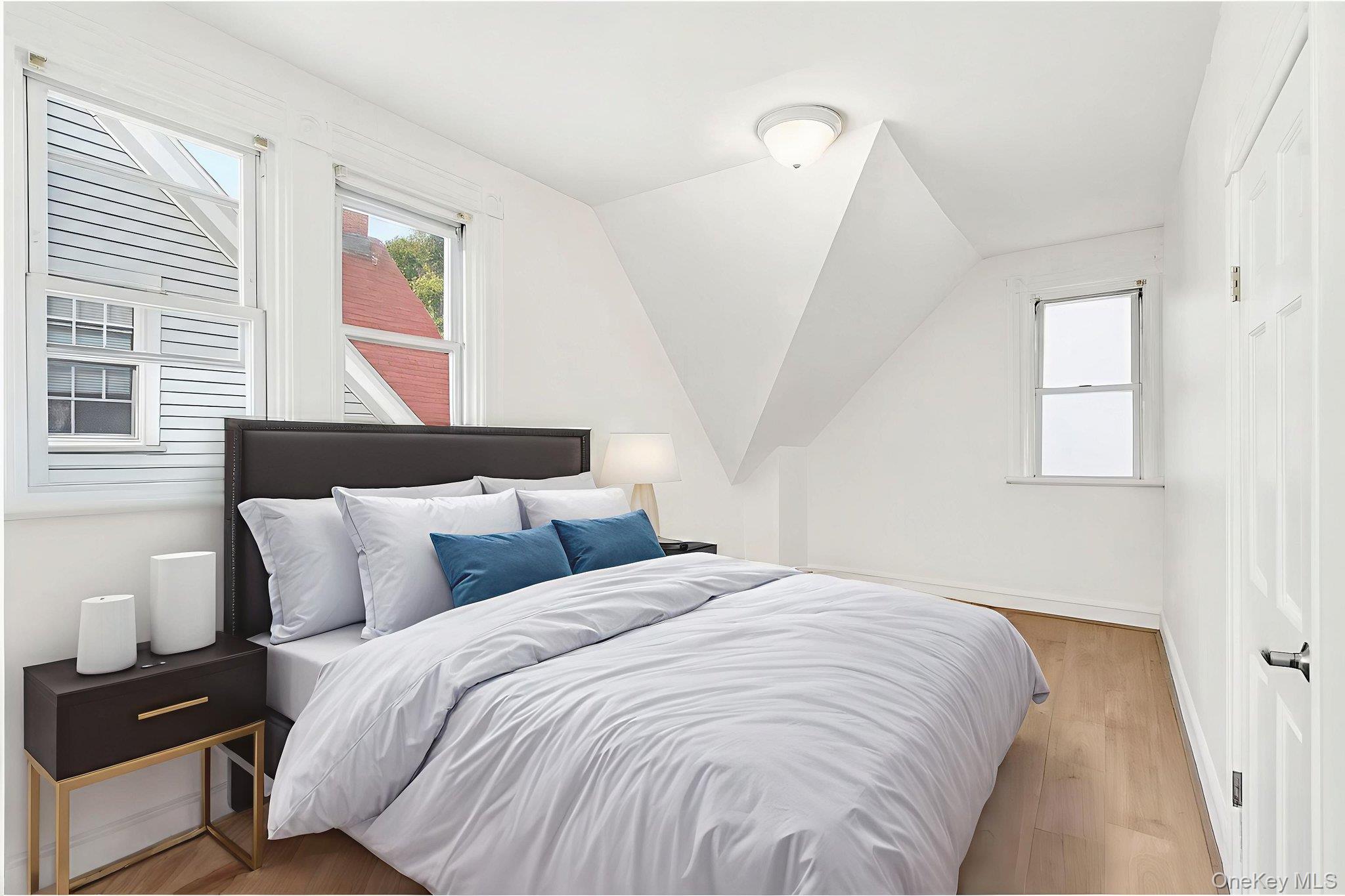 3340 Perry Avenue Bronx, NY 10467 - Photo 16 of 42 a bedroom with bed and window