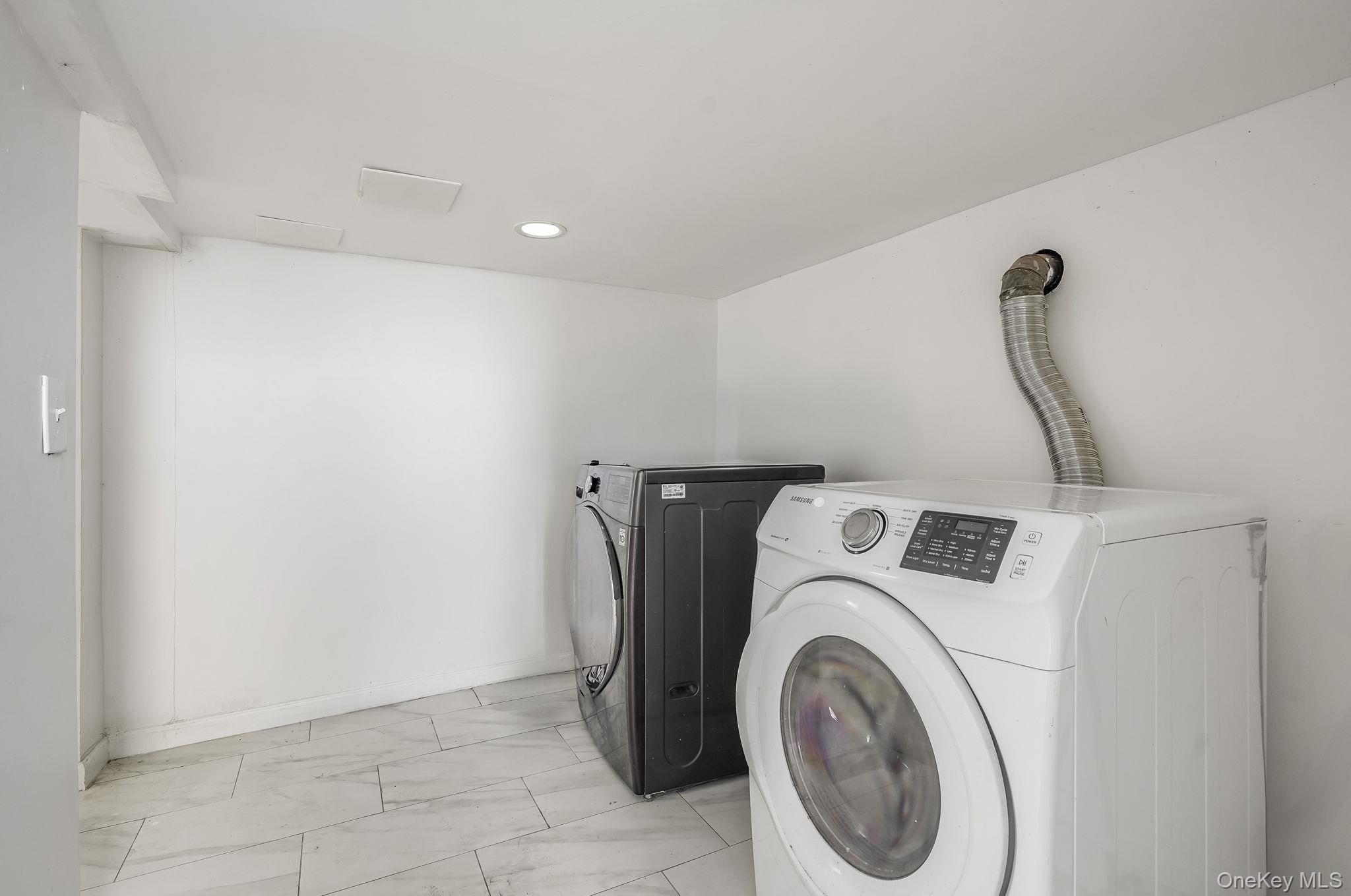 3340 Perry Avenue Bronx, NY 10467 - Photo 30 of 42 a utility room with dryer and washer
