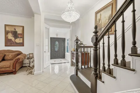 a view of a livingroom with furniture and floor to ceiling windows