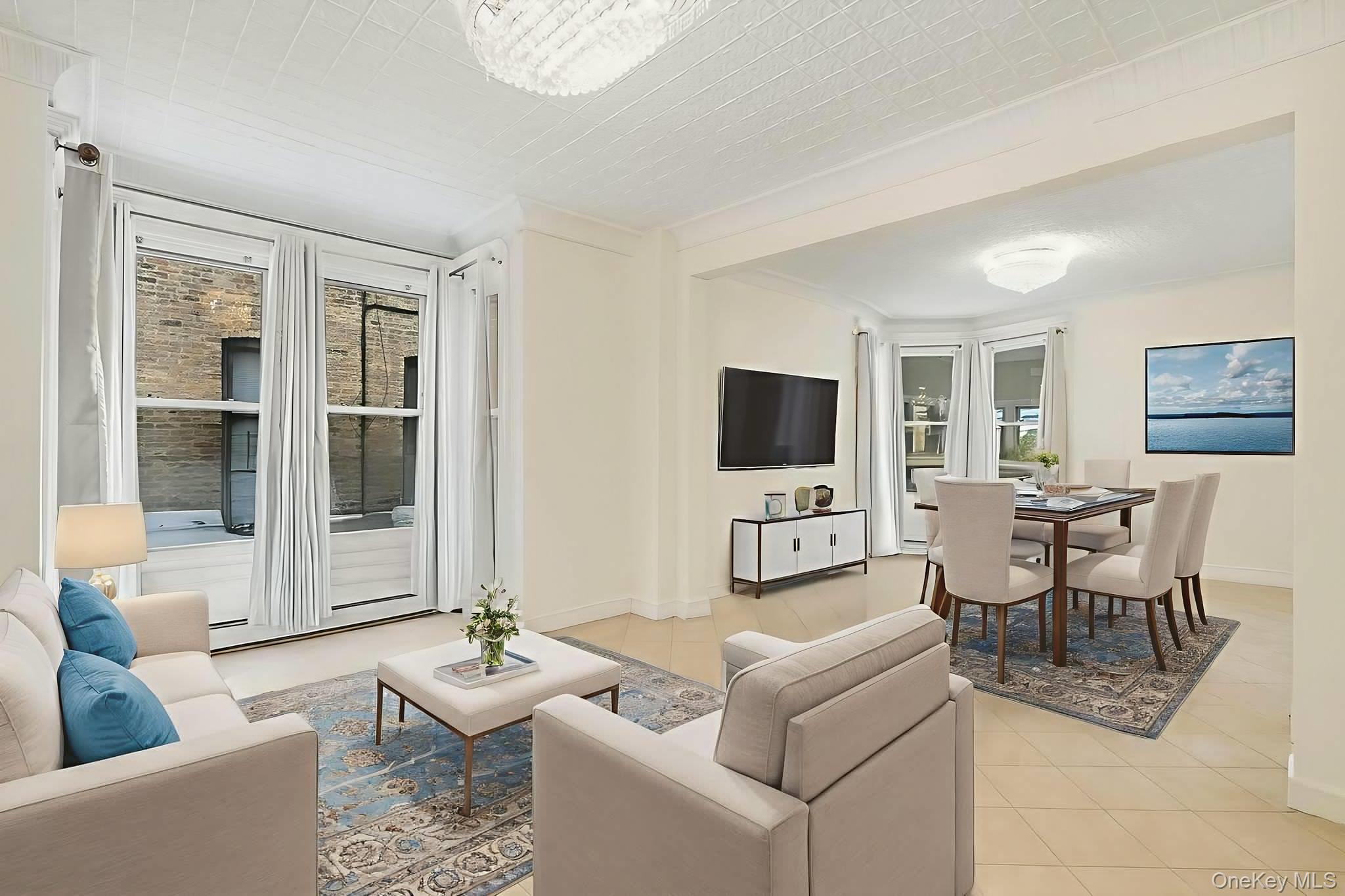 3340 Perry Avenue Bronx, NY 10467 - Photo 10 of 42 a living room with furniture and a flat screen tv