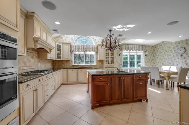 a large kitchen with lots of counter space and windows
