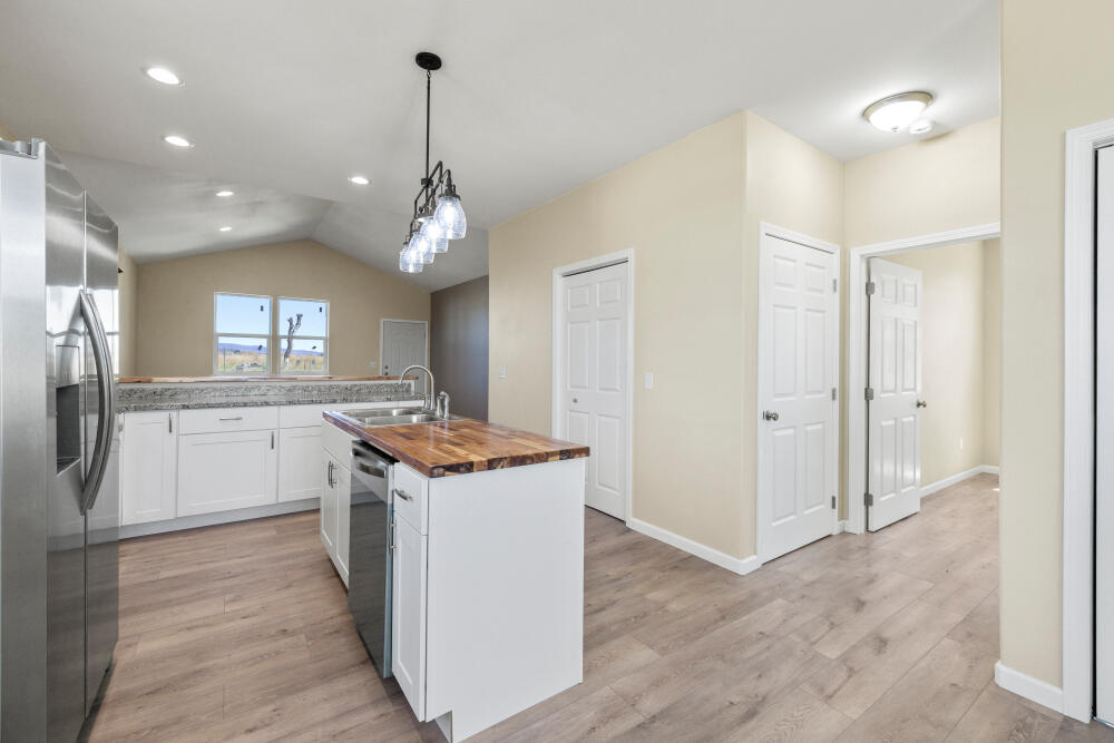 330 North Elm Street Merrill, OR 97633 - Photo 16 of 23 a kitchen that has a lot of cabinets in it