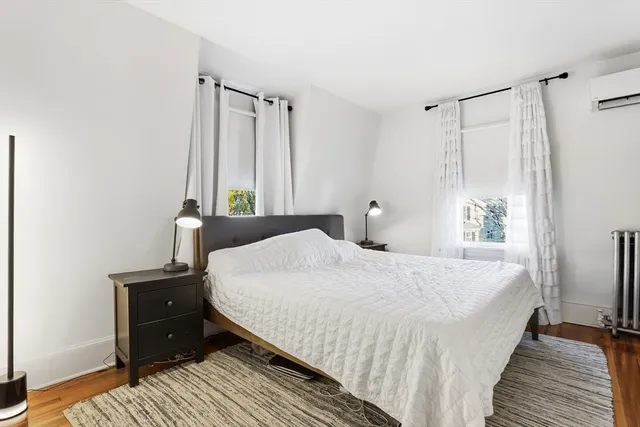 a bedroom with a bed and a cabinets