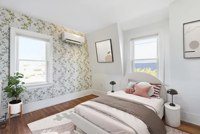 an empty room with windows and closet