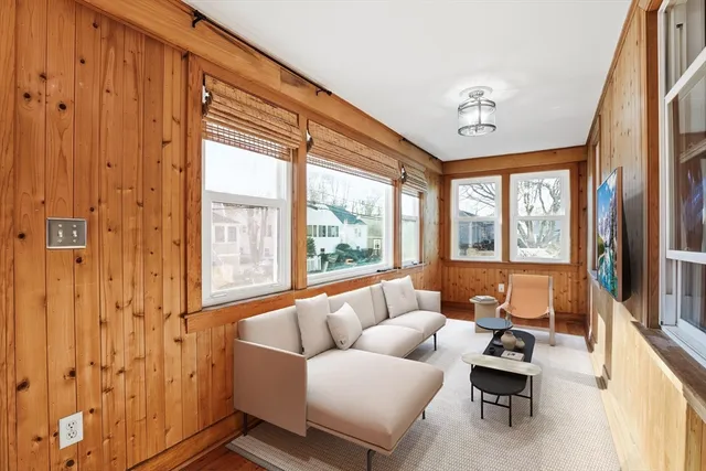 a view of a room with furniture and wooden floor