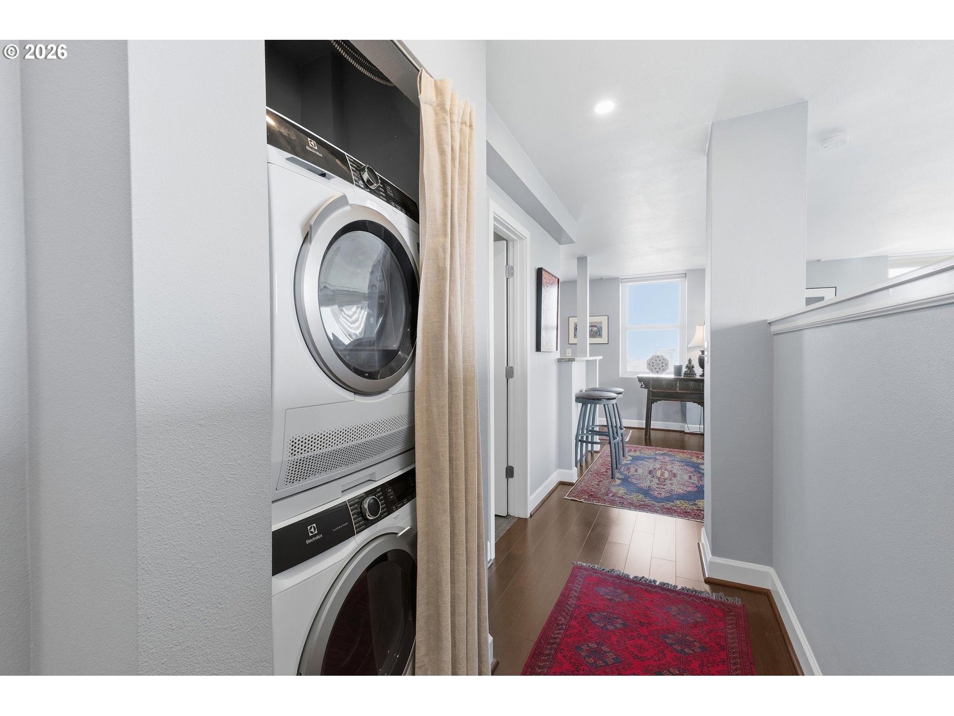 1205 Southwest Cardinell Drive, Unit 702 Portland, OR 97201 - Photo 16 of 17 a view of a hallway with washer and dryer