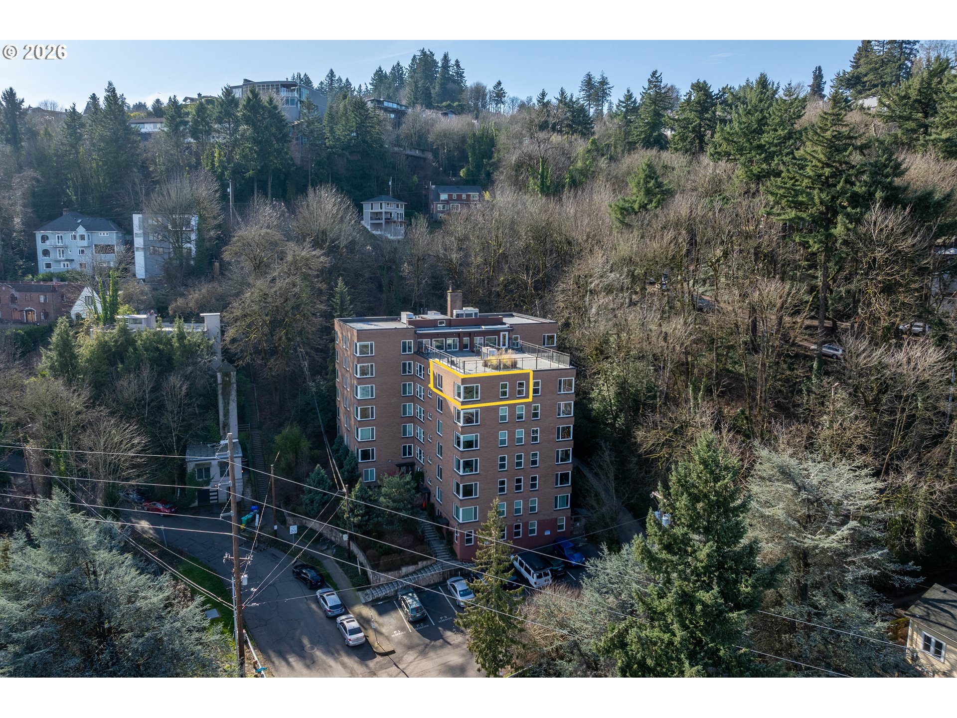 1205 Southwest Cardinell Drive, Unit 702 Portland, OR 97201 - Photo 17 of 17 a view of a house with a yard and trees