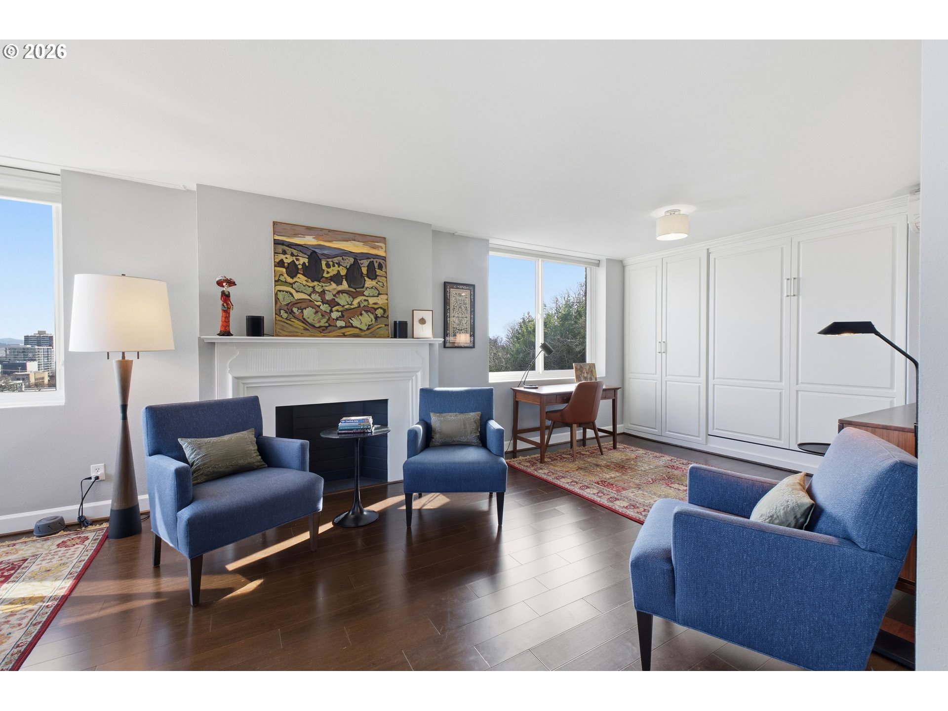 1205 Southwest Cardinell Drive, Unit 702 Portland, OR 97201 - Photo 3 of 17 a living room with furniture and a fireplace
