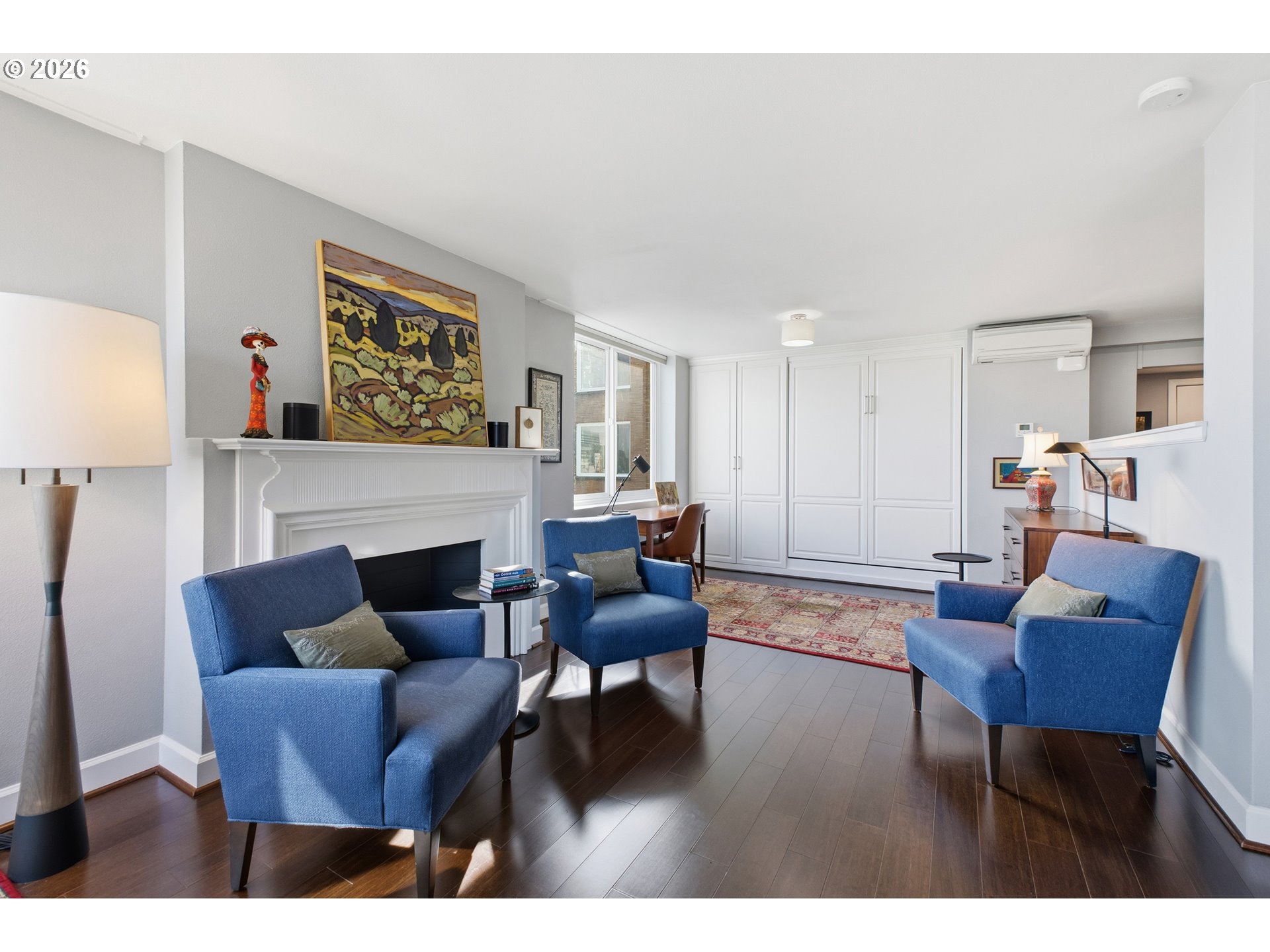 1205 Southwest Cardinell Drive, Unit 702 Portland, OR 97201 - Photo 7 of 17 a living room with furniture and a fireplace