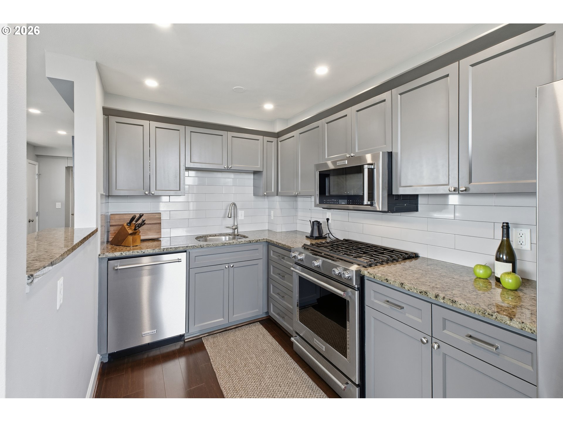 1205 Southwest Cardinell Drive, Unit 702 Portland, OR 97201 - Photo 9 of 17 a kitchen with a sink stove and refrigerator