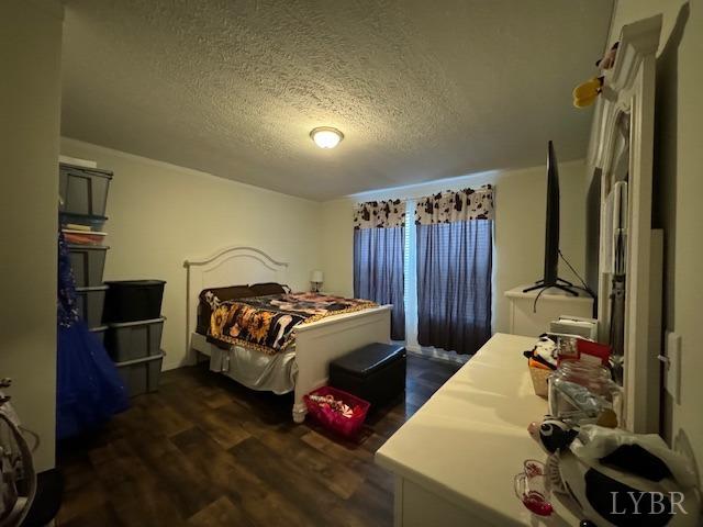 6098 Promise Land Road Appomattox, VA 24522 - Photo 23 of 35 a bedroom with a bed and a flat tv screen on dresser