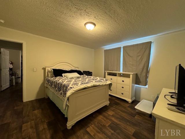 6098 Promise Land Road Appomattox, VA 24522 - Photo 24 of 35 a bedroom with a bed and a flat screen tv