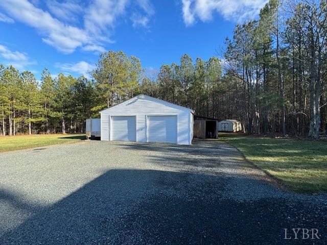 6098 Promise Land Road Appomattox, VA 24522 - Photo 32 of 35 a front view of a house with a yard and garage