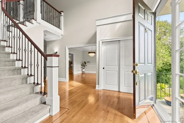 a view of an entryway with wooden floor