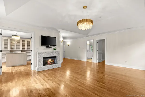 a kitchen with kitchen island wooden cabinets and refrigerator