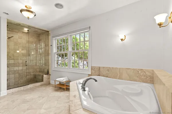 a view of backyard with swimming pool and outdoor seating