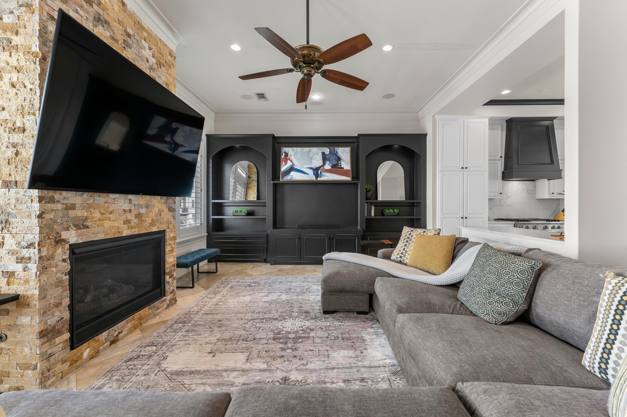 5215 Feagan Street, Unit A Houston, TX 77007 - Photo 14 of 35 a living room with furniture a fireplace and a flat screen tv