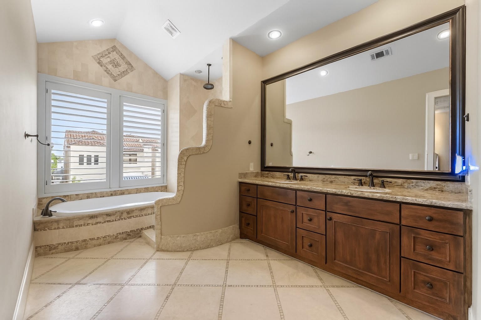 5215 Feagan Street, Unit A Houston, TX 77007 - Photo 20 of 35 a bathroom with a granite countertop sink and a mirror
