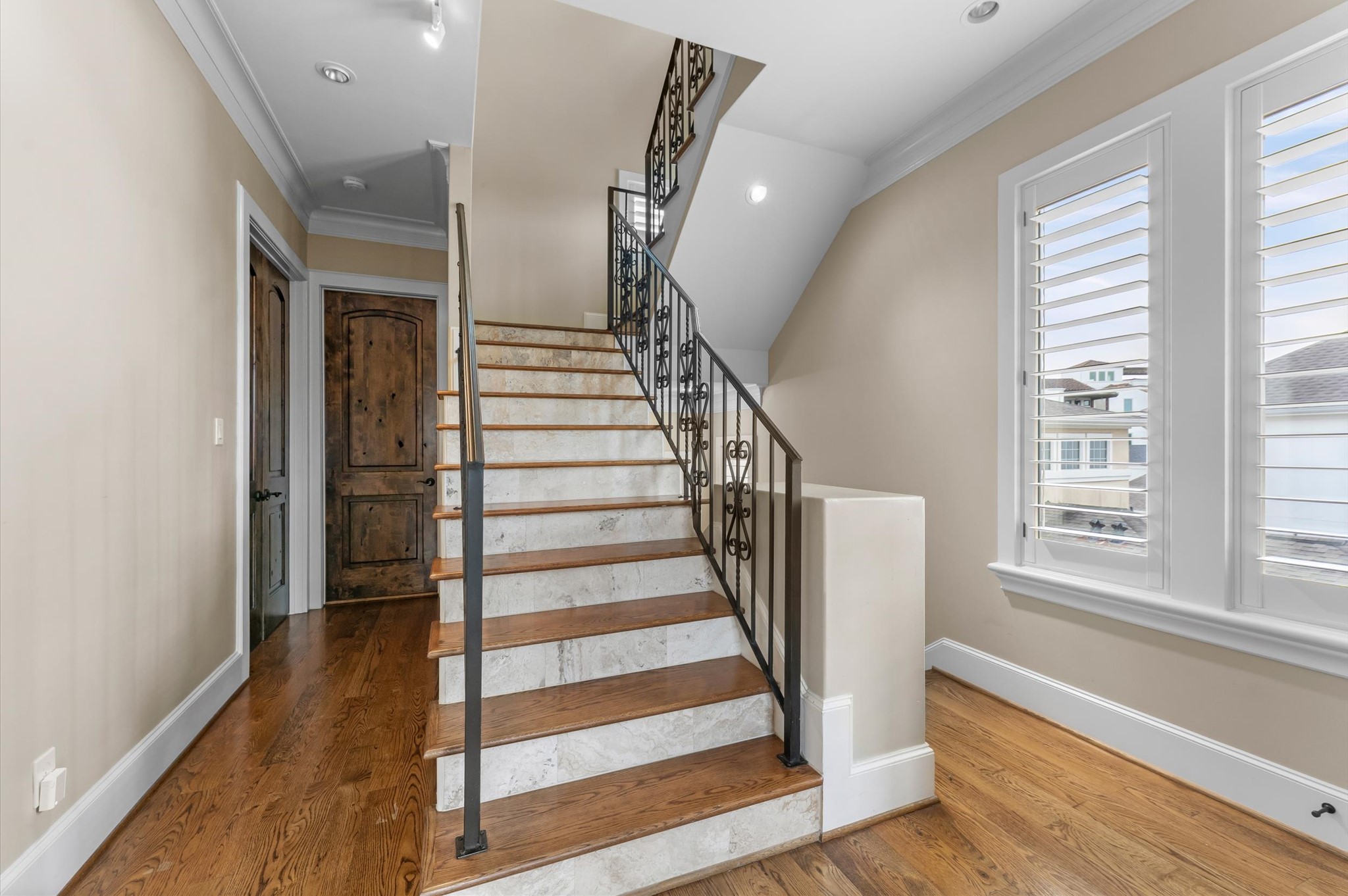 5215 Feagan Street, Unit A Houston, TX 77007 - Photo 24 of 35 a view of entryway with wooden floor and stairs