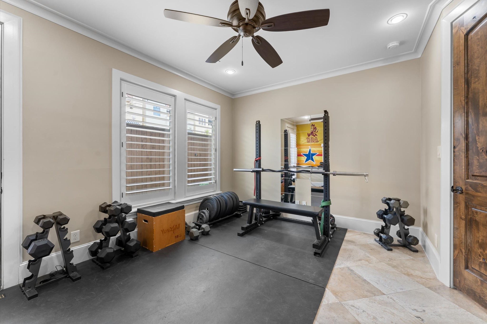 5215 Feagan Street, Unit A Houston, TX 77007 - Photo 26 of 35 a room with gym equipment and a large window