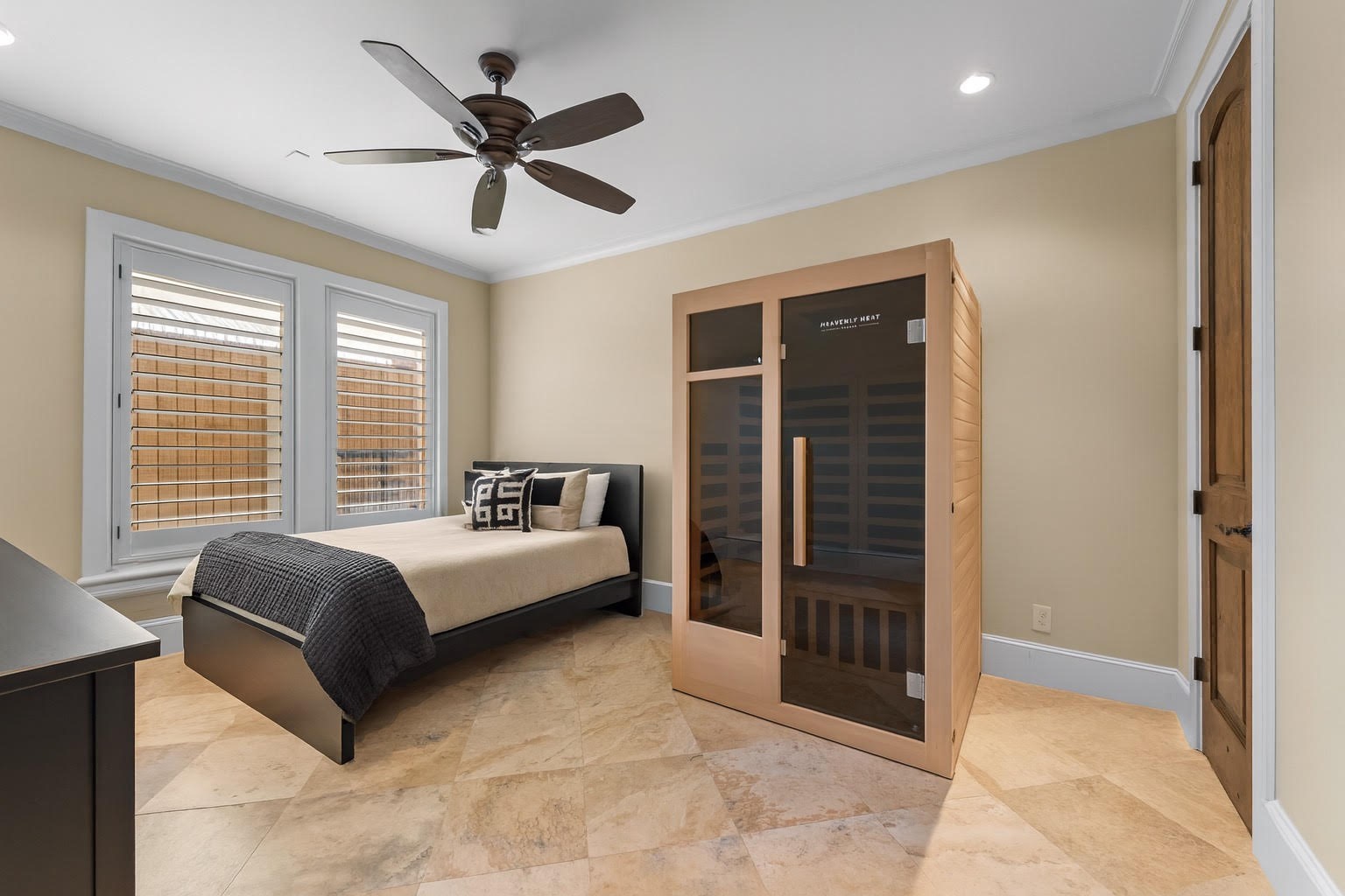 5215 Feagan Street, Unit A Houston, TX 77007 - Photo 27 of 35 a spacious bedroom with a bed and a cabinets