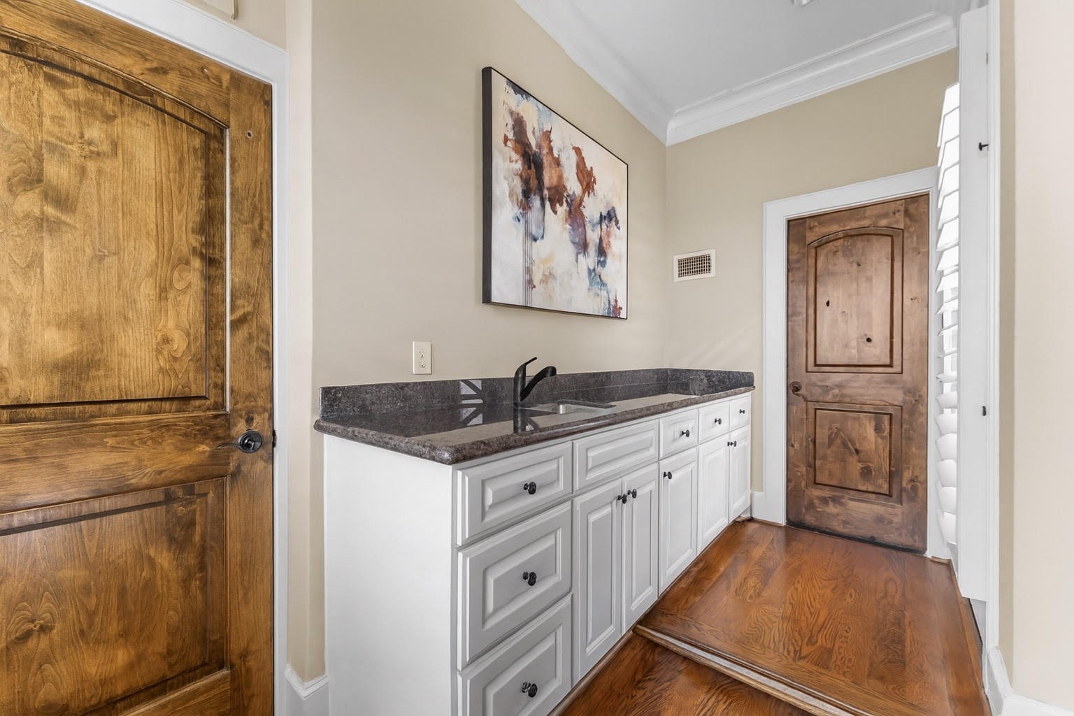 5215 Feagan Street, Unit A Houston, TX 77007 - Photo 30 of 35 a kitchen with white cabinets and sink