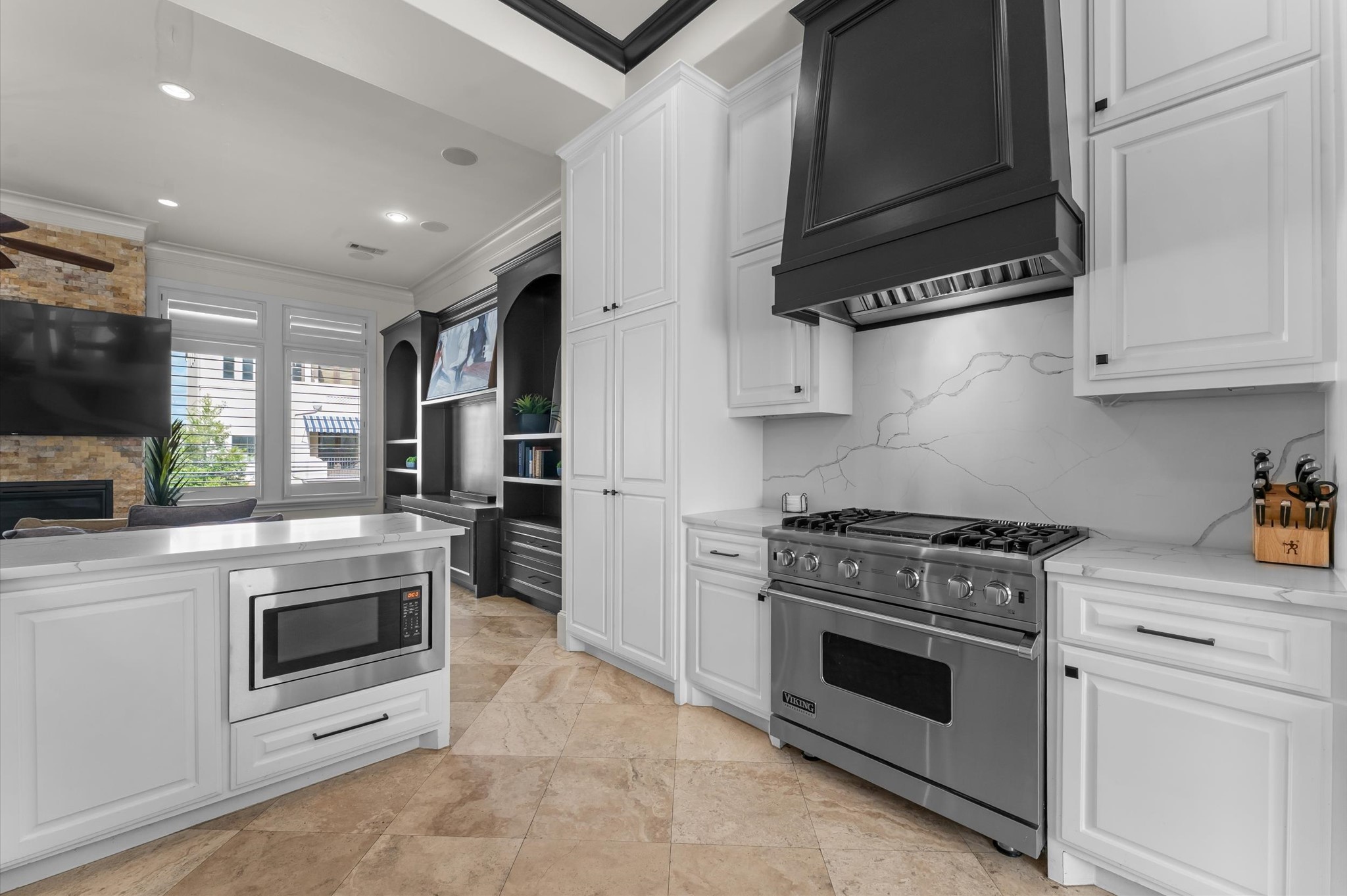 5215 Feagan Street, Unit A Houston, TX 77007 - Photo 6 of 35 a kitchen with stainless steel appliances granite countertop a stove and white cabinets