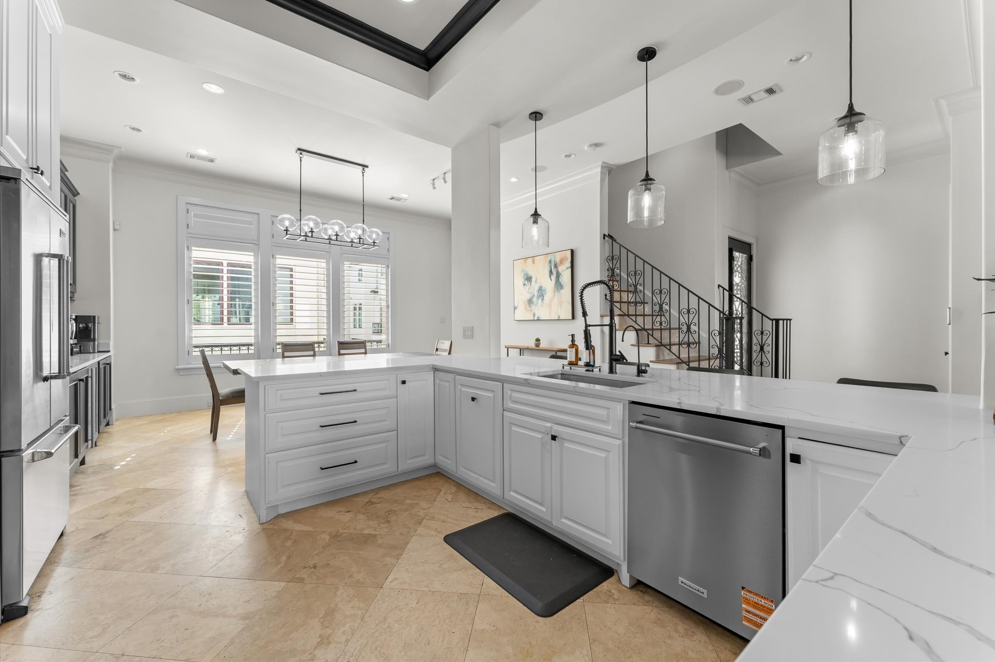 5215 Feagan Street, Unit A Houston, TX 77007 - Photo 8 of 35 a large kitchen with kitchen island a large counter space a sink appliances and cabinets
