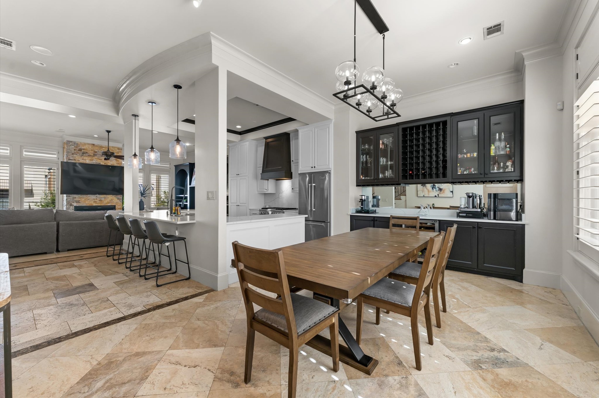 5215 Feagan Street, Unit A Houston, TX 77007 - Photo 9 of 35 a view of a dining room with furniture a chandelier and kitchen view