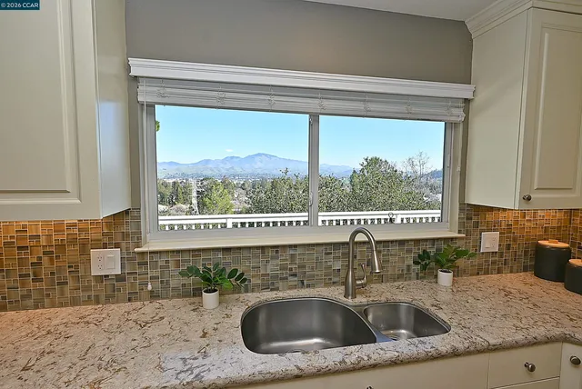 a bedroom with a bed and a chair