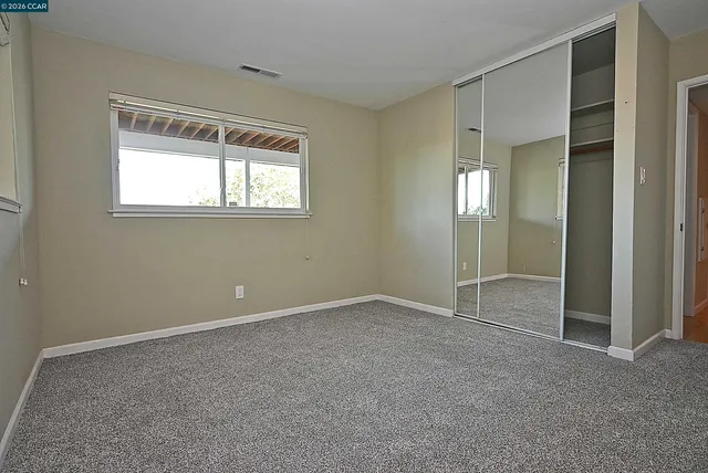 a view of two chairs in the balcony
