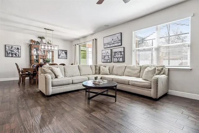 a living room with furniture and a large window