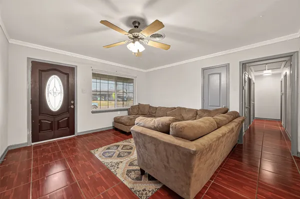 a living room with furniture and a window