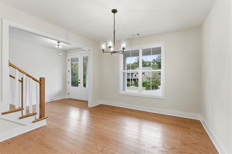 9 Everwood Court Rome, GA 30161 - Photo 16 of 44 a view of a room with wooden floor chandelier and windows