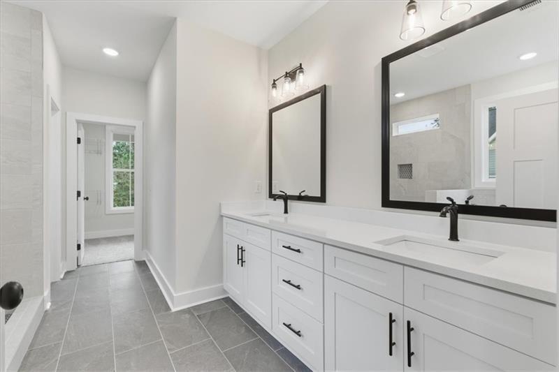 9 Everwood Court Rome, GA 30161 - Photo 22 of 44 a spacious bathroom with double vanity sinks and a mirror