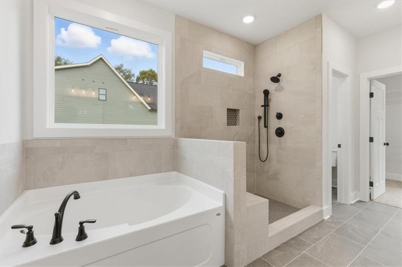 9 Everwood Court Rome, GA 30161 - Photo 23 of 44 a white bath tub sitting next to a shower