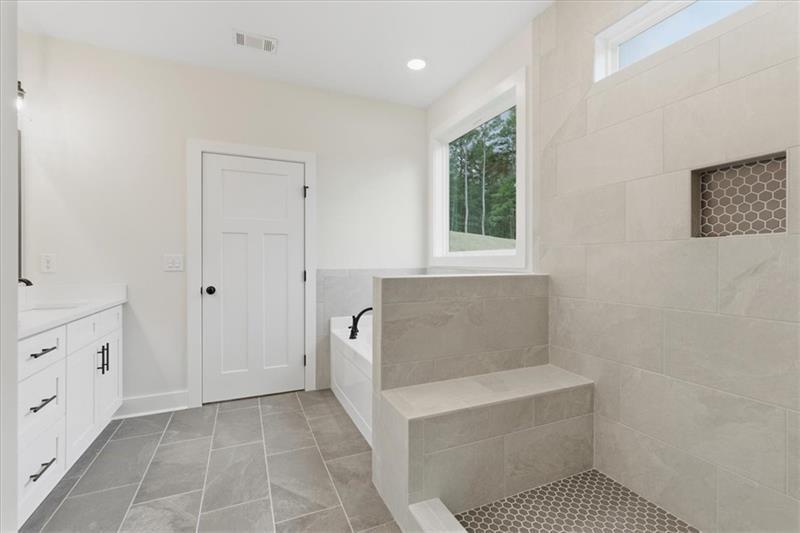 9 Everwood Court Rome, GA 30161 - Photo 24 of 44 a bathroom with a tub shower and sink