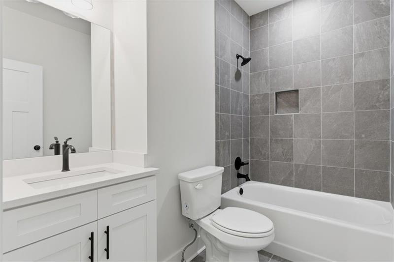 9 Everwood Court Rome, GA 30161 - Photo 26 of 44 a bathroom with a sink a toilet and shower