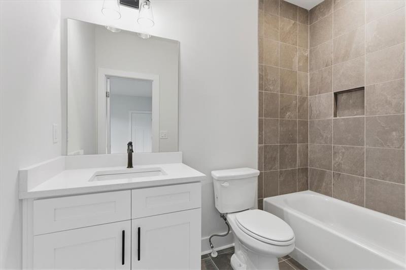 9 Everwood Court Rome, GA 30161 - Photo 28 of 44 a bathroom with a sink a toilet and shower