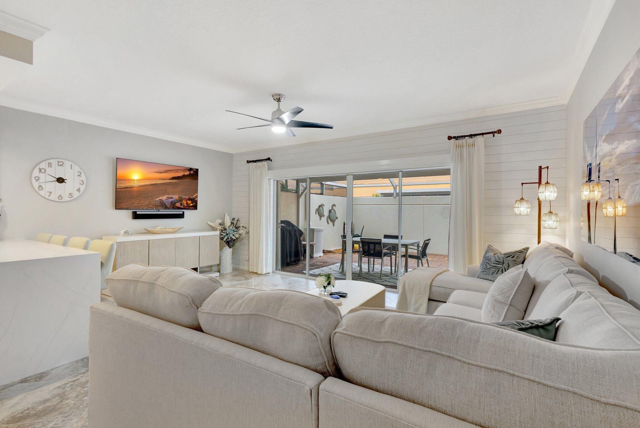 39 Laurel Oaks Circle Tequesta, FL 33469 - Photo 11 of 47 a living room with furniture and a flat screen tv