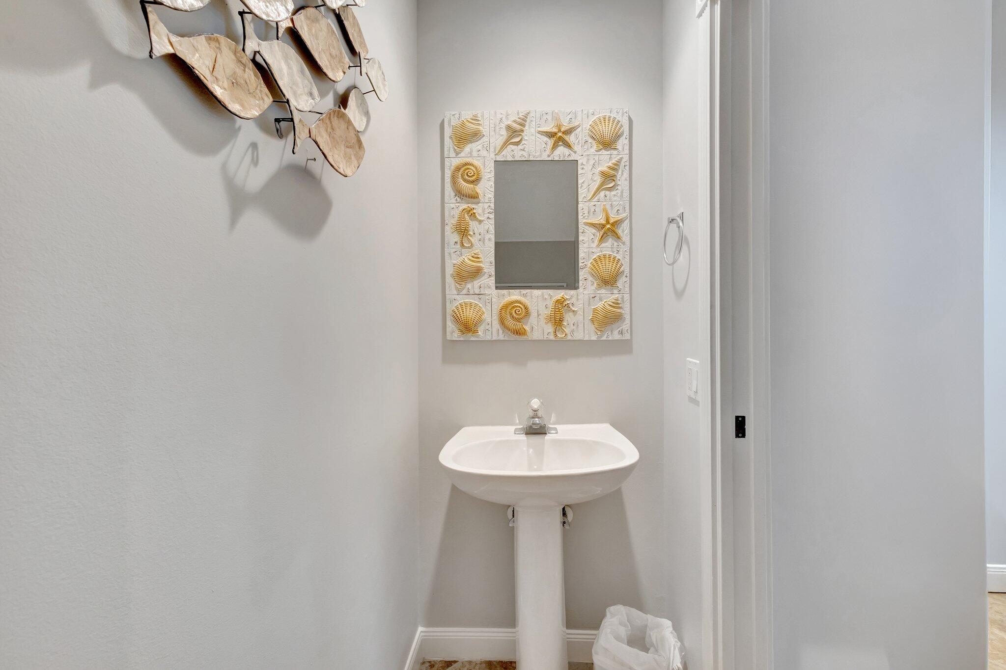 39 Laurel Oaks Circle Tequesta, FL 33469 - Photo 13 of 47 a bathroom with a sink and a mirror