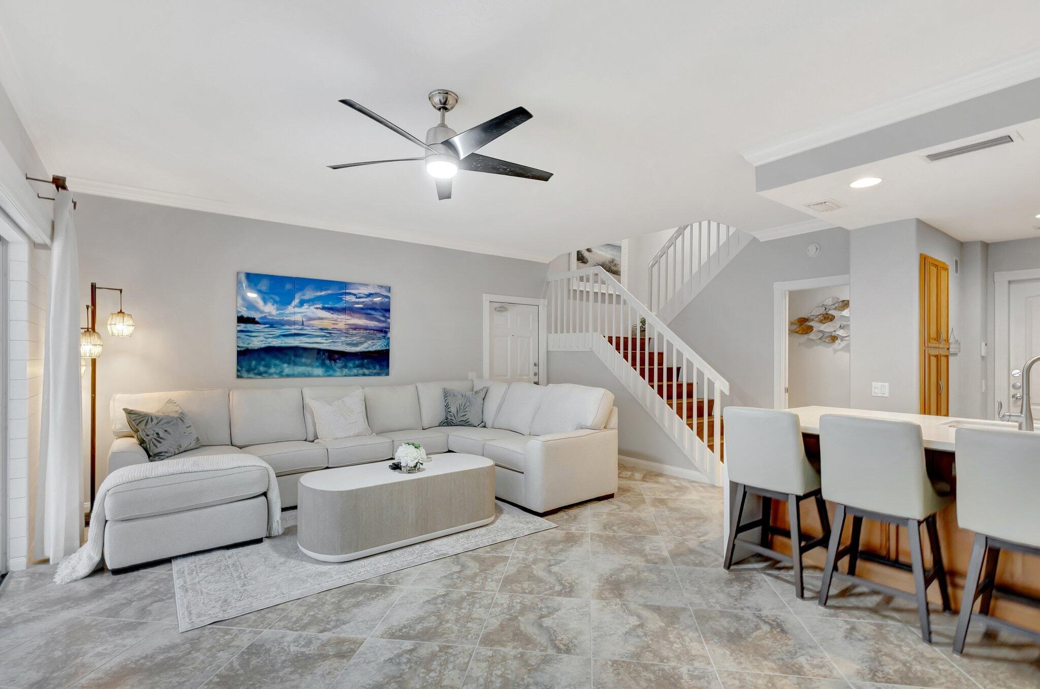 39 Laurel Oaks Circle Tequesta, FL 33469 - Photo 2 of 47 a living room with furniture and a wooden floor