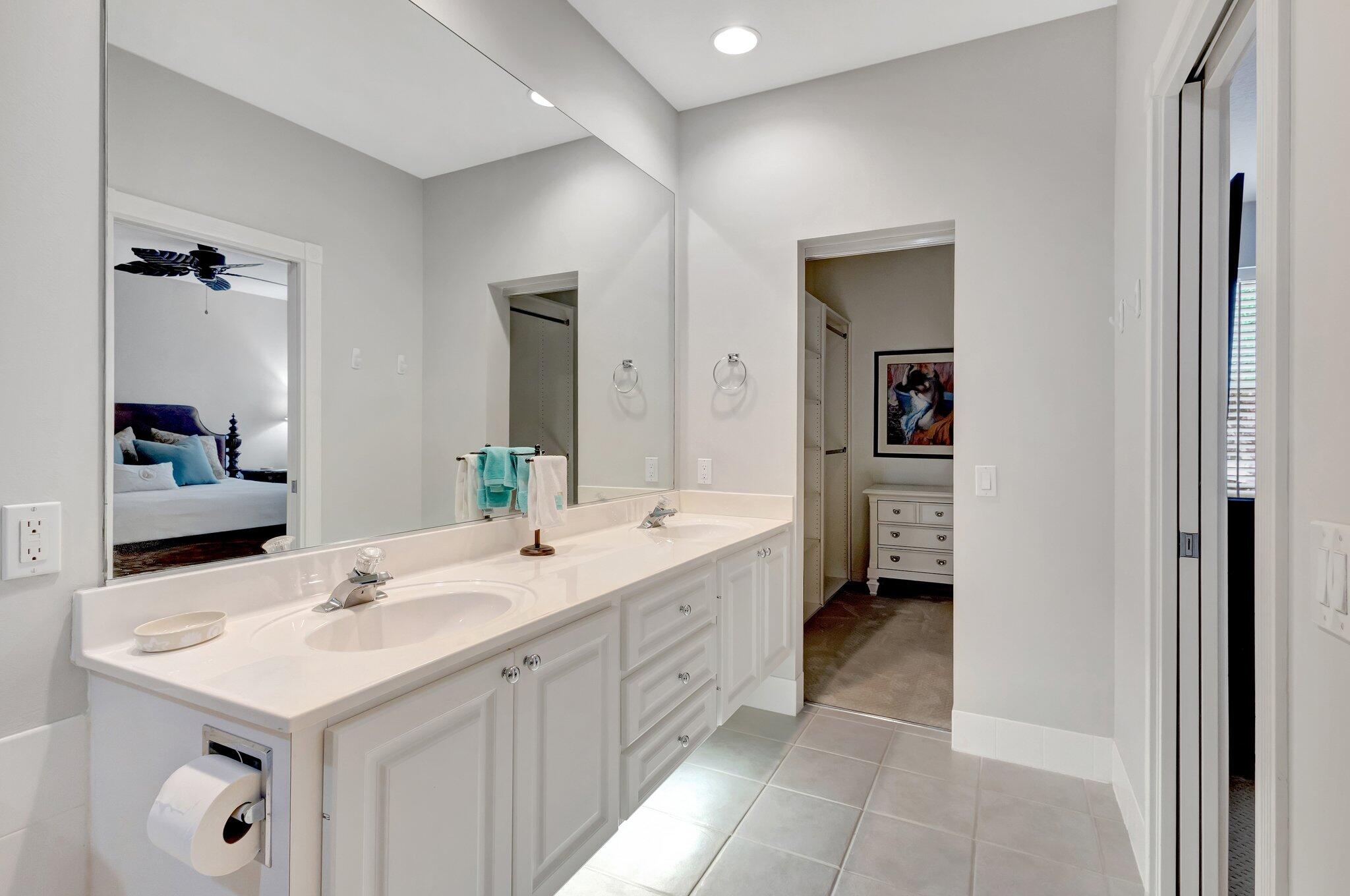 39 Laurel Oaks Circle Tequesta, FL 33469 - Photo 24 of 47 a bathroom with a sink and a mirror