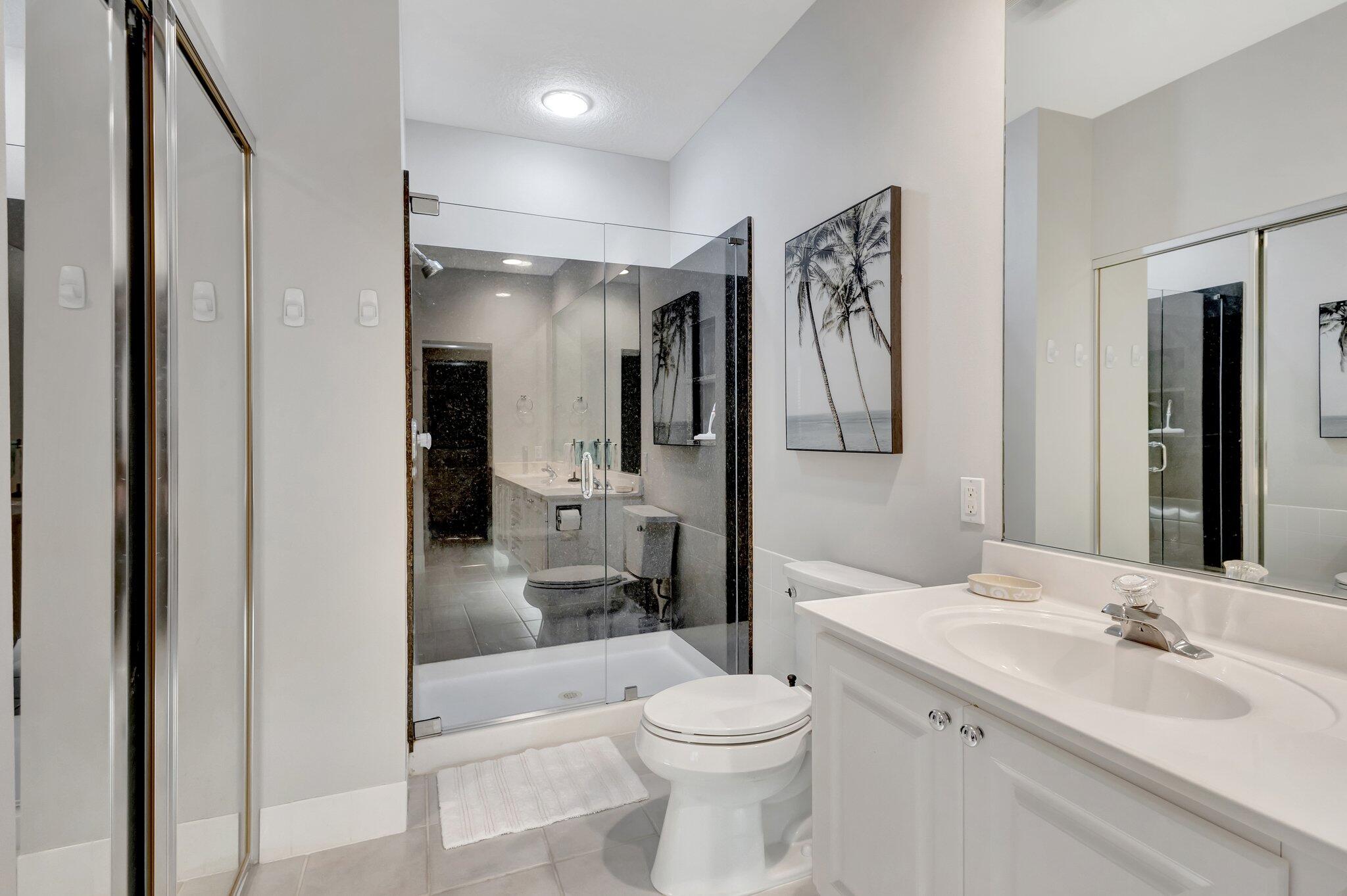 39 Laurel Oaks Circle Tequesta, FL 33469 - Photo 25 of 47 a bathroom with a sink a toilet and shower