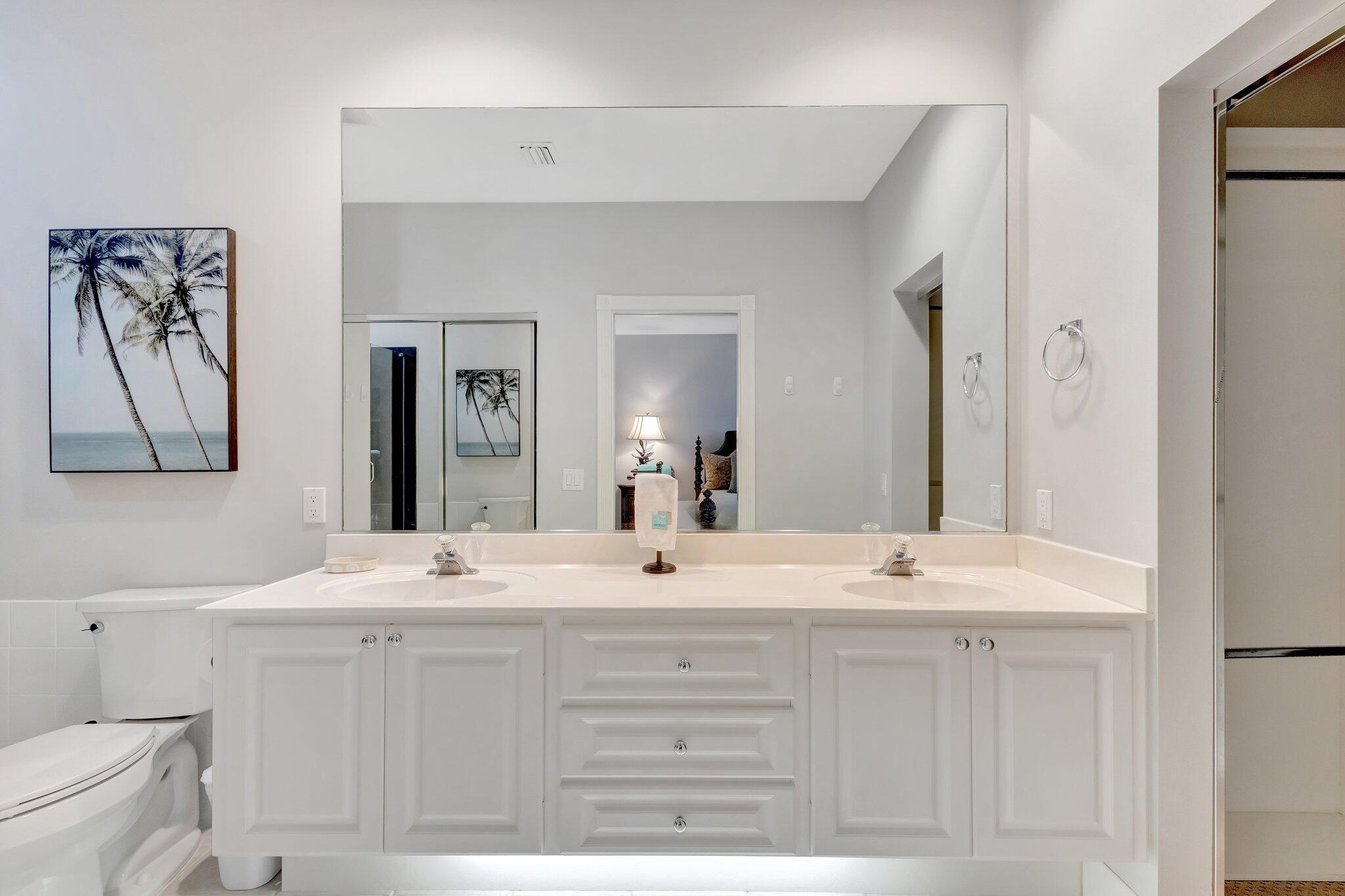 39 Laurel Oaks Circle Tequesta, FL 33469 - Photo 26 of 47 a bathroom with a sink vanity and a mirror