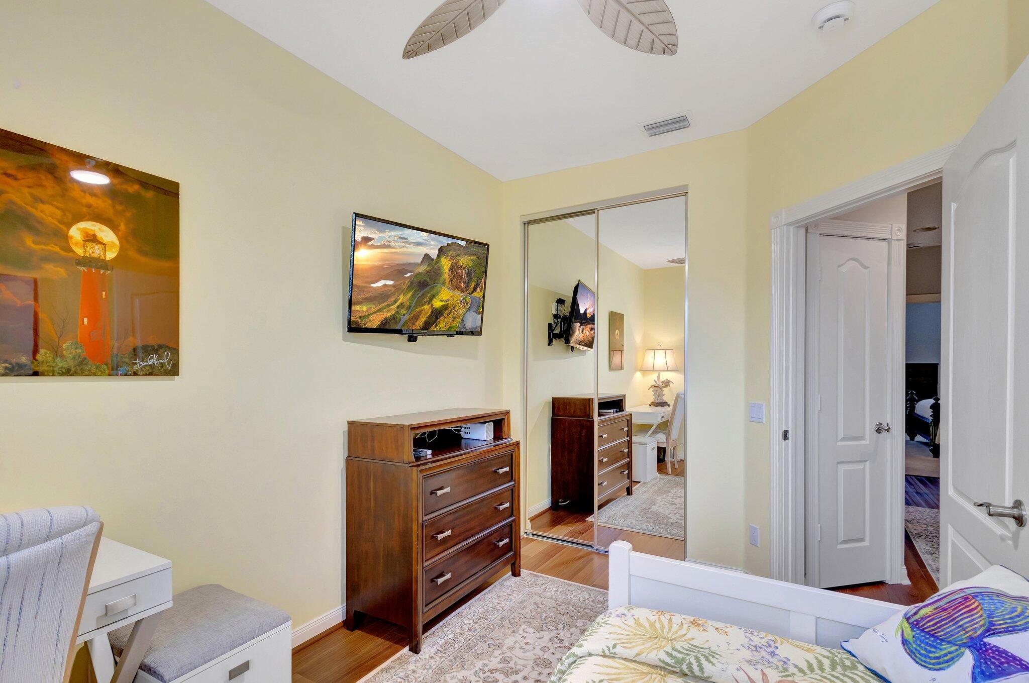 39 Laurel Oaks Circle Tequesta, FL 33469 - Photo 28 of 47 a bedroom with a bed and furniture