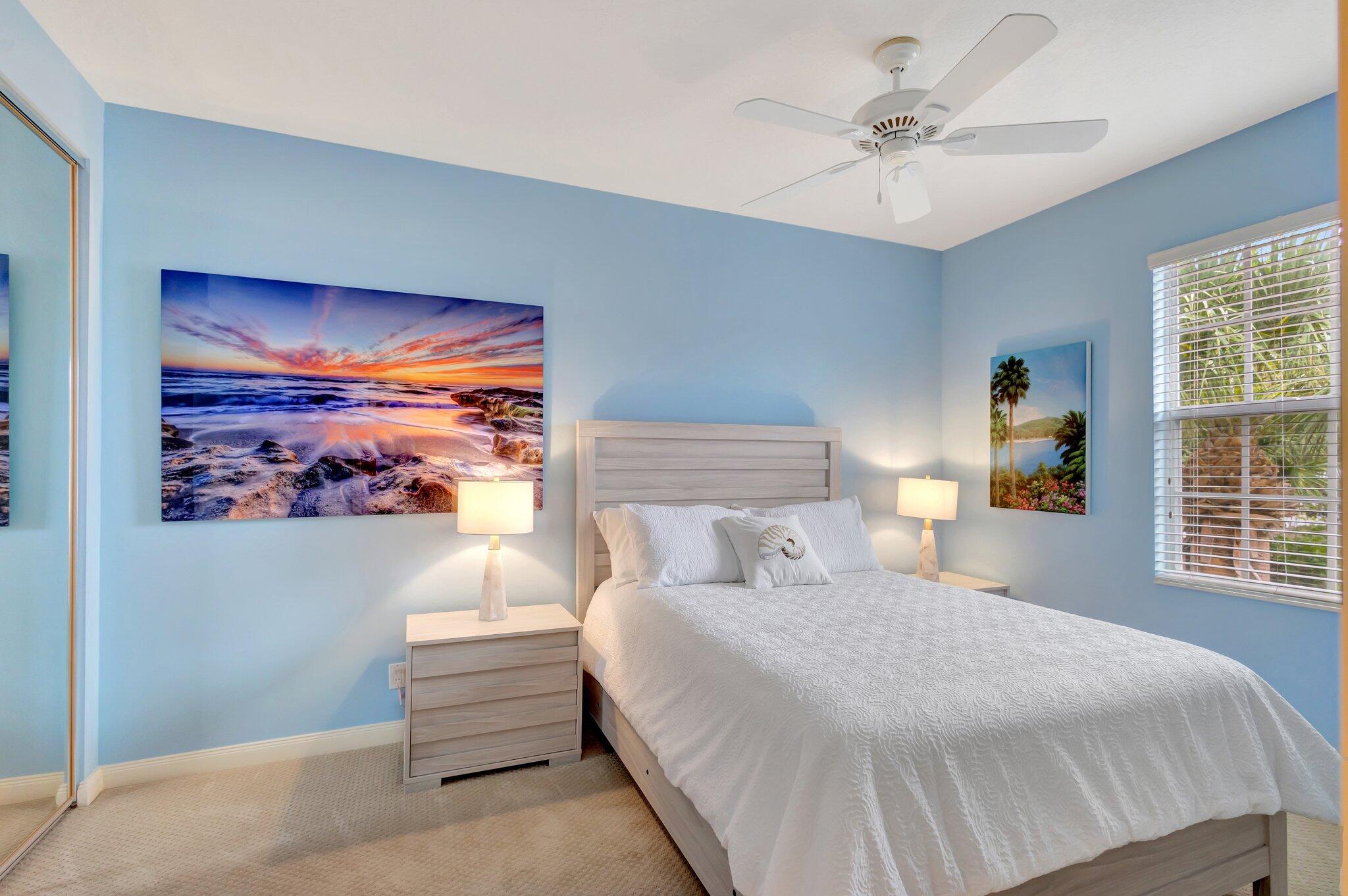 39 Laurel Oaks Circle Tequesta, FL 33469 - Photo 29 of 47 a bedroom with a bed and a painting on the wall