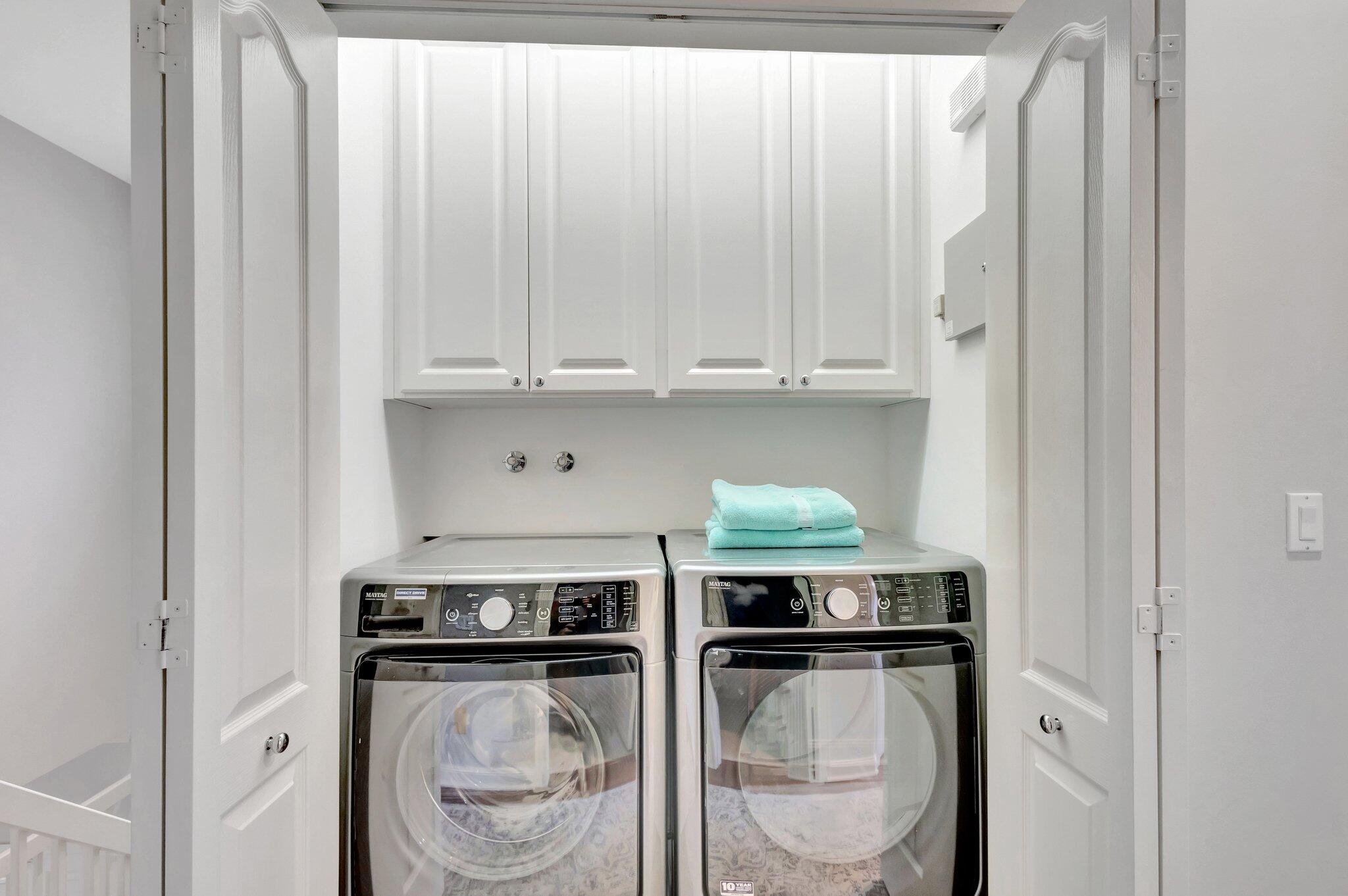 39 Laurel Oaks Circle Tequesta, FL 33469 - Photo 33 of 47 a kitchen with stainless steel appliances granite countertop a stove a microwave and a refrigerator